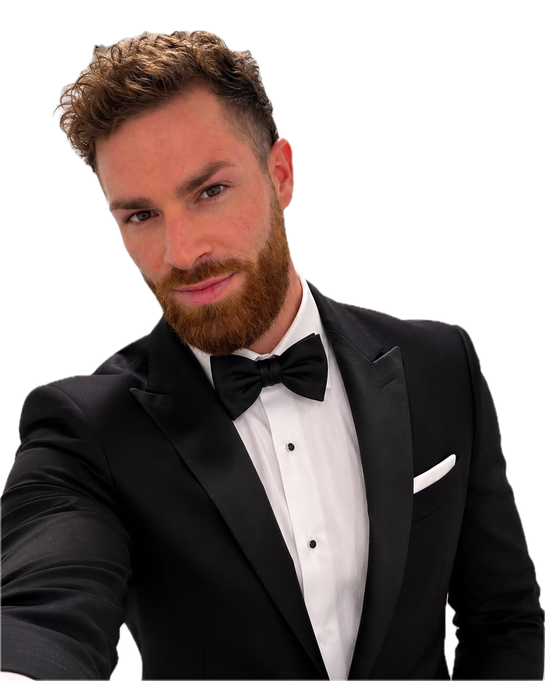 Darren Rebeiro in a black dinner suit and bow tie, smiling at the camera